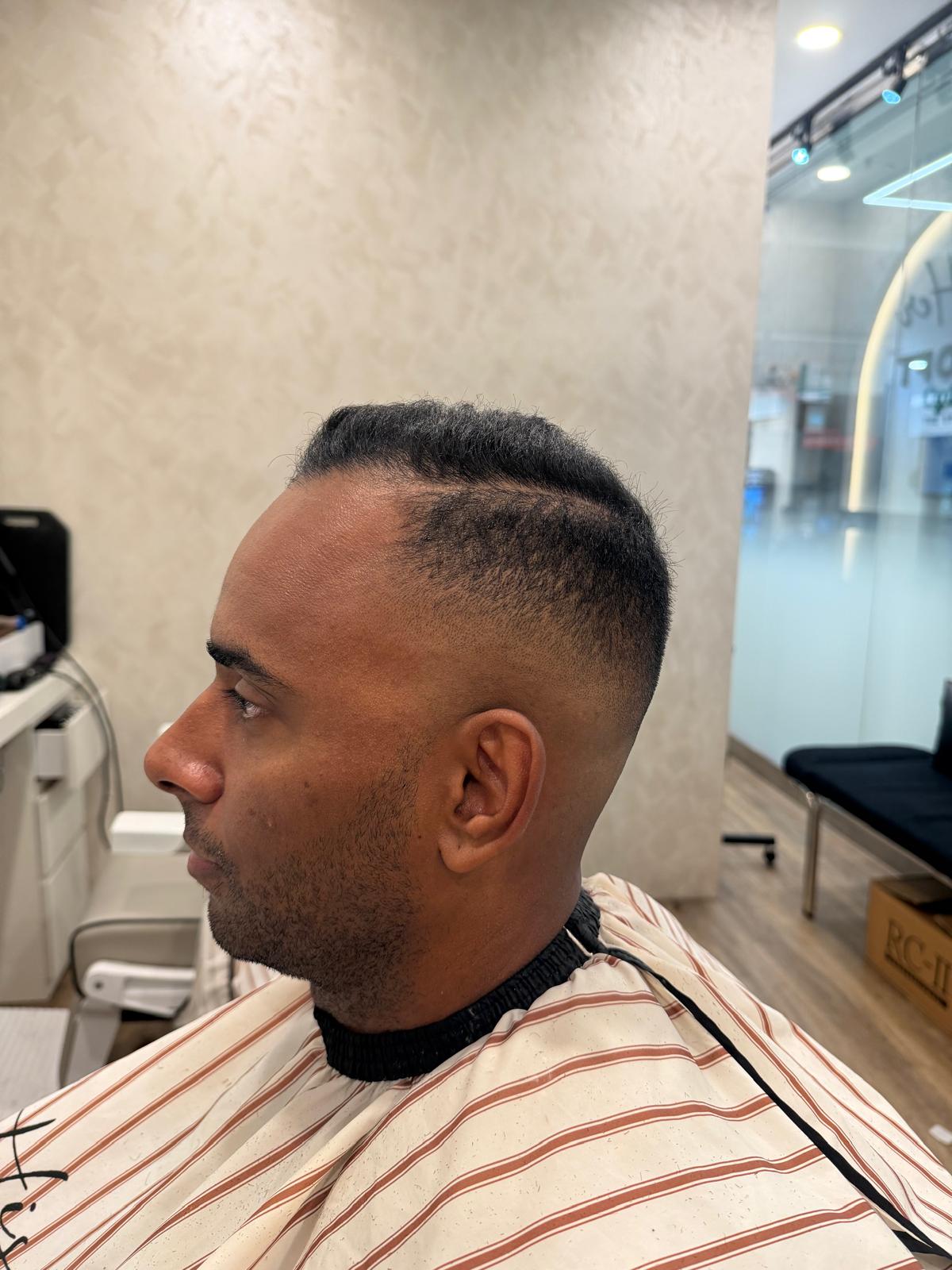 Short haircut with a defined side part