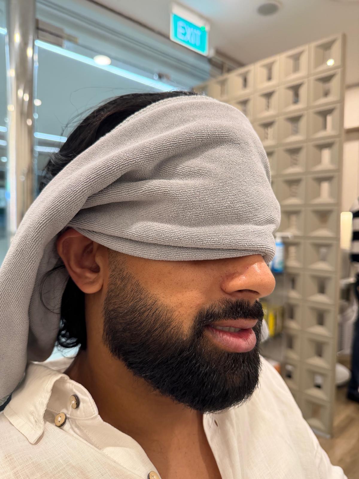 Beard and moustache visible during a salon grooming visit